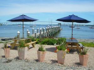 Shaded picnic tables with views of the bay